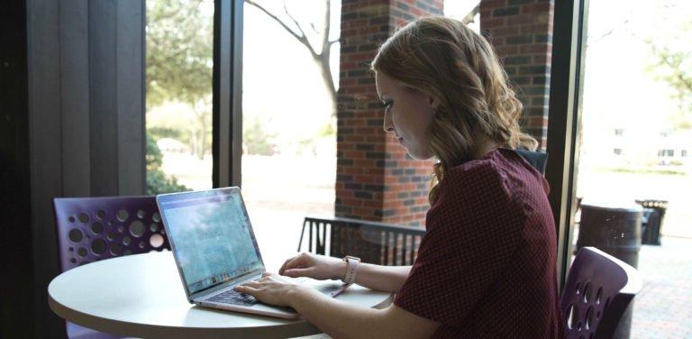 HSU student working on her laptop